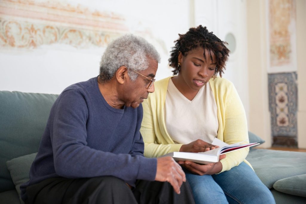 Two people enjoying a warm conversation representing Companionship and Emotional Support.