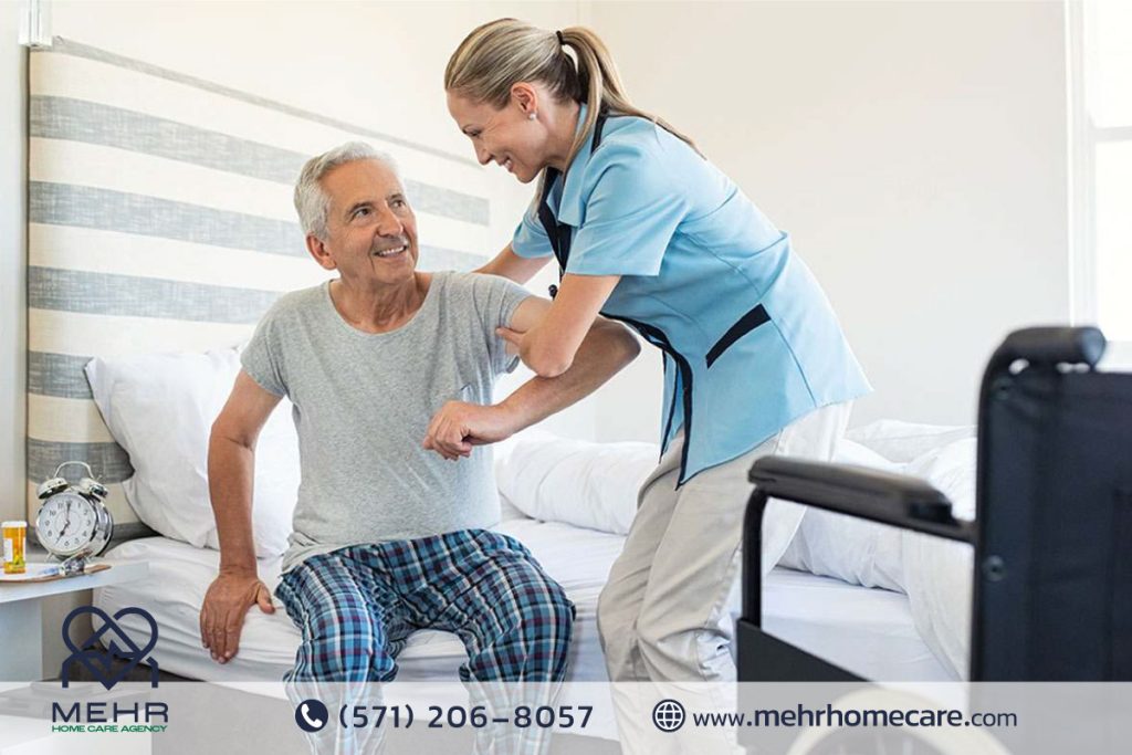 Caregiver preparing a healthy meal and assisting an elderly person with feeding at the dining table.