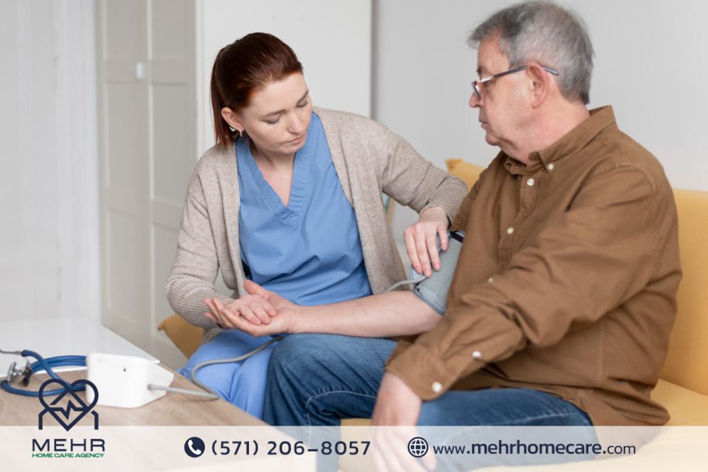 Nurse assisting an elderly man with a blood pressure check in his home to ensure senior care safety.